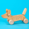 Bajo: bright wooden dachshund on wheels