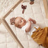 Concept pour enfants: tapis de jeu matelassé rond