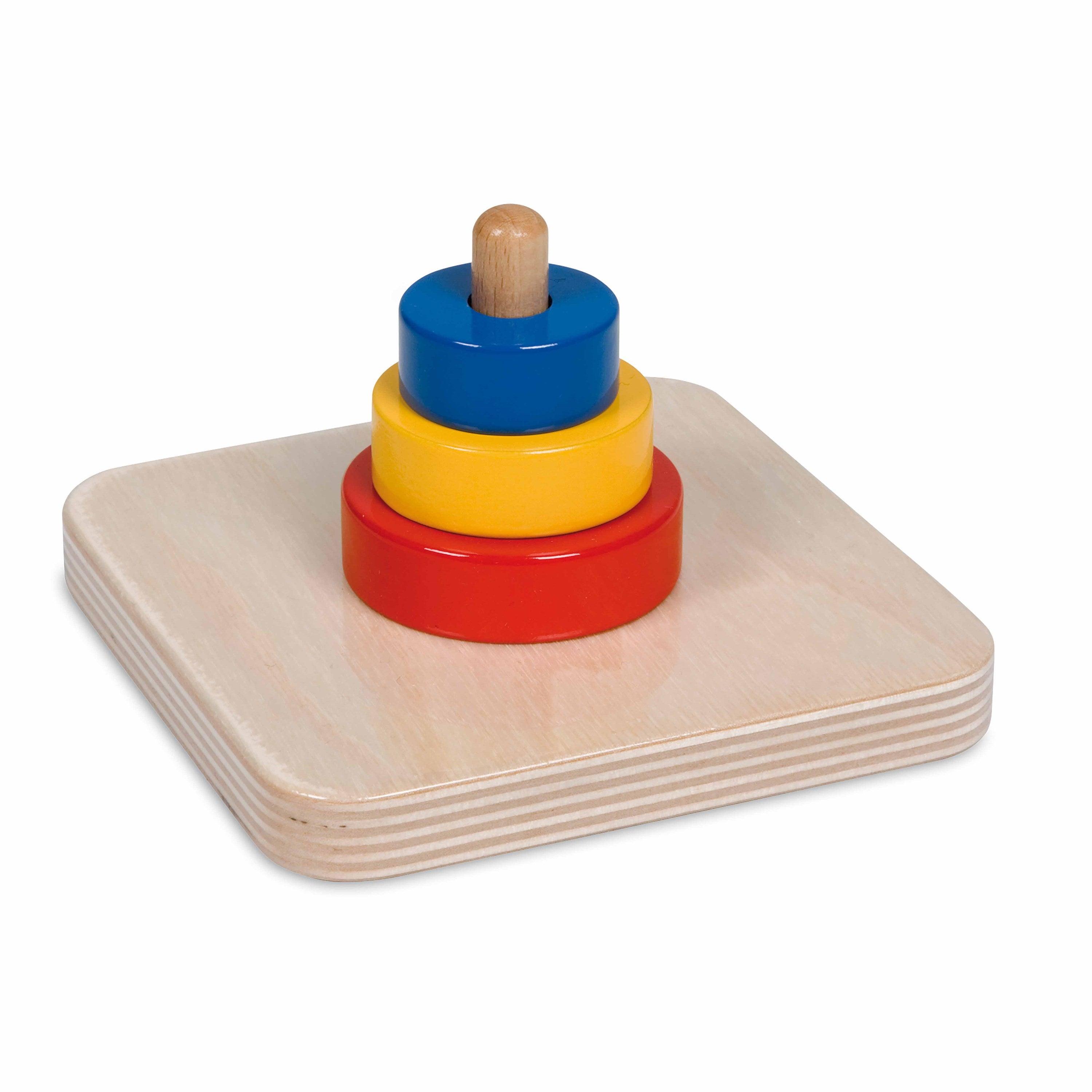 Nienhuis Montessori: наслагване на три диска върху вертикален дюбел
